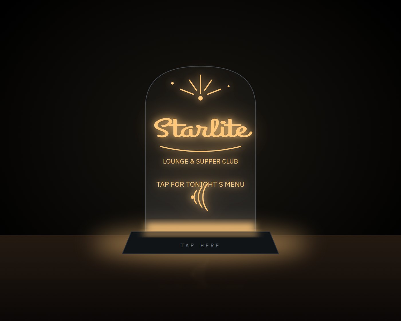 Edge-lit clear acrylic table sign glowing warm amber on a black base, reading Starlite Lounge & Supper Club, tap for tonight's menu